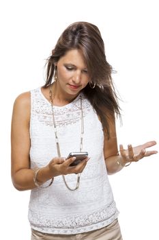 Vivacious attractive woman reacting to a text message on her mobile phone flicking her hair in the air and staring at the phone with her mouth open, on white with copyspace