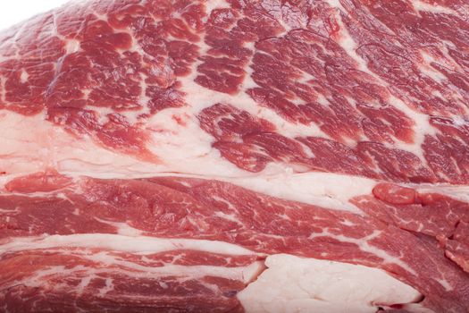 Fresh Slice of Protein Rich Raw Beef Meat on Top of the Table on White Background