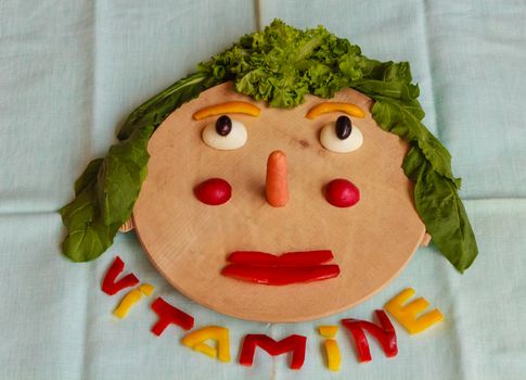 a cutting-board in the shape of her face smiling invites us to a correct  and healthy food habit