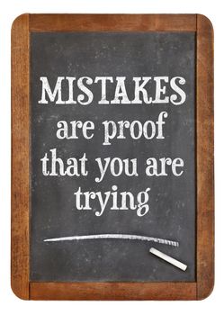 Mistakes are proof that you are trying - motivational text on a vintage slate blackboard