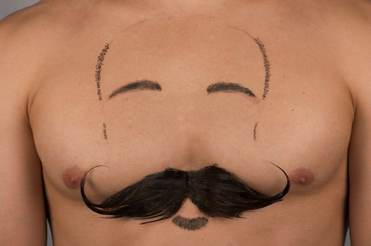 male torso with moustache and beard at chest