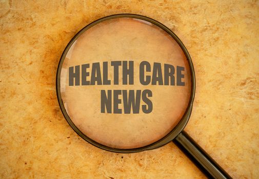 Magnifying glass focused health care news 