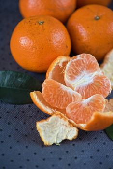 Ripe tangerines on wooden background