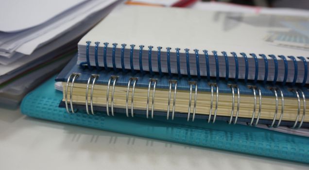 Office documents, the paper notes, account book placed on the desk at work.                               