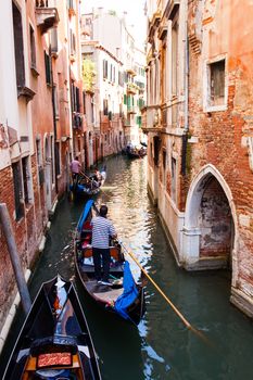 VENICE, ITALY - MAY 06: View of typical Gondolier in the Venice lagoon on May 06, 2015