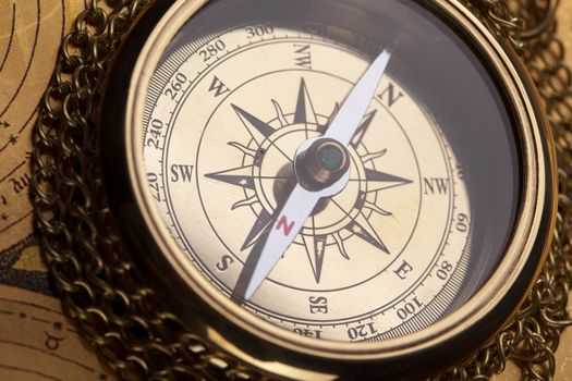 Compass on the old map background