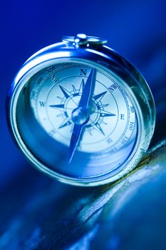 Compass on the old paper background