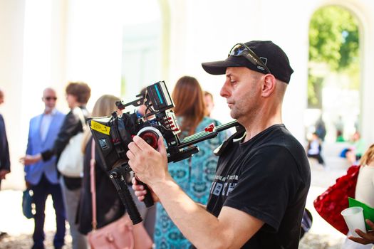 VENICE, ITALY - MAY 06: Cameraman in action during the 56th Venice Biennale on May 06, 2015