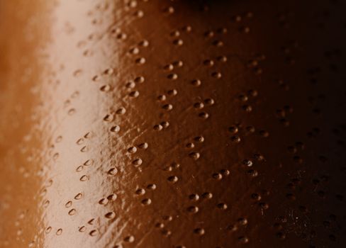 Close up photo of a brown water drop pattern 