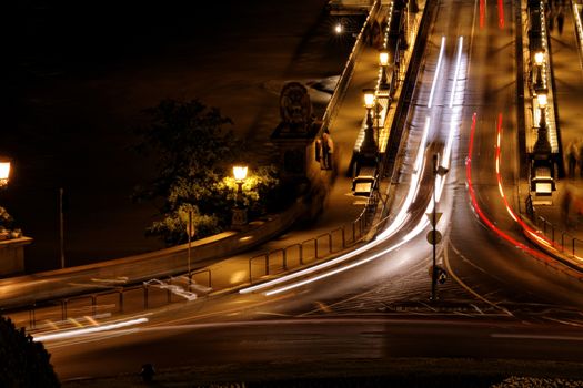 Public transport on the Suspension Bridge at night in Budapest