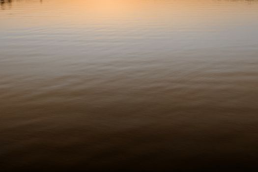 Photo of a calm lake in dusk 