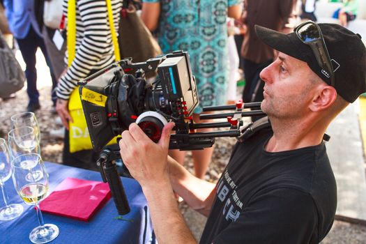 VENICE, ITALY - MAY 06: Cameraman in action during the 56th Venice Biennale on May 06, 2015