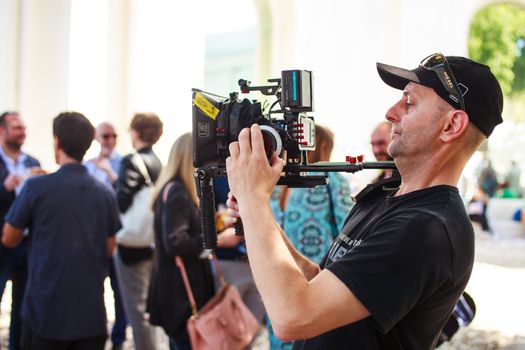 VENICE, ITALY - MAY 06: Cameraman in action during the 56th Venice Biennale on May 06, 2015