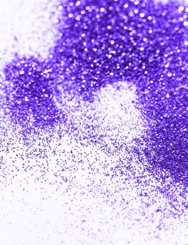 Purple glitter on light background - macro photo