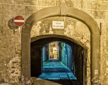 Ancient narrow street in Pisa - Italy.