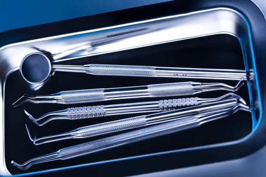 Dentist equipment on blue background