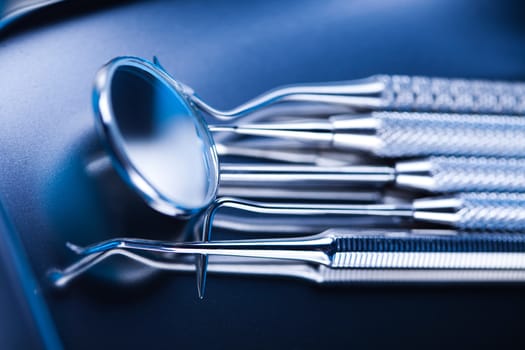 Dentist equipment on blue background