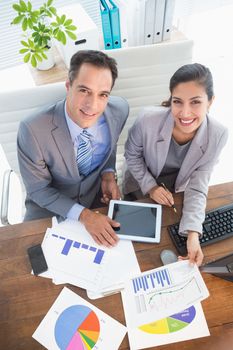 Businesswoman working with team mate in an office