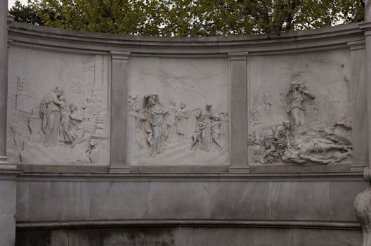 A collection of figures, on a carved stone wall in Vienna, Europa