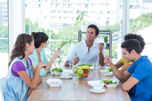 Young business people having lunch together