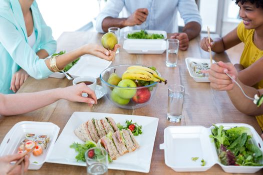 Young business people having lunch together