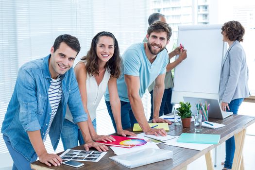 Portrait of creative business people in meeting at office