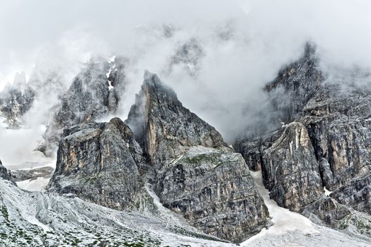 Storm clouds over the top of the mountains Pale di San Martino, landscape from Venegia Valley in a summer rainy afternoon, Trentino - Italy