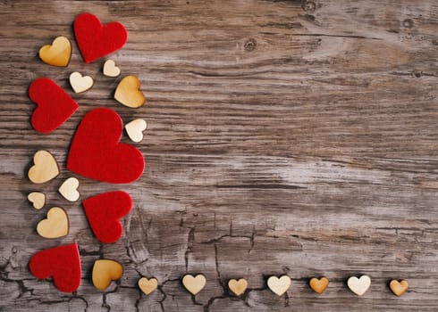 hearts on old wooden background