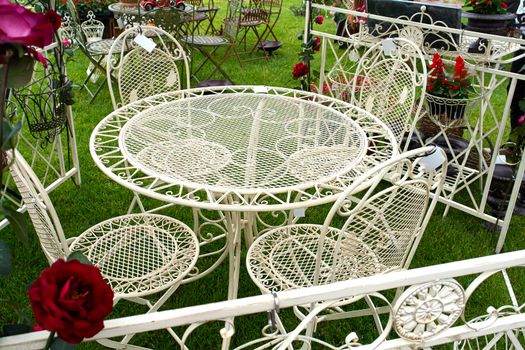 Classical design garden furniture painted in white                