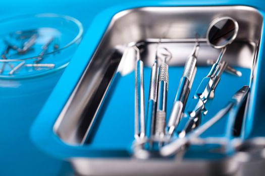 Dentist equipment on blue background