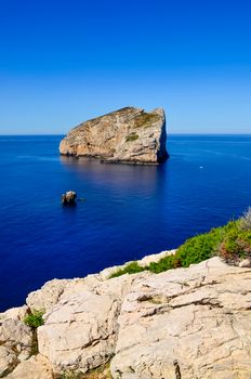 Peaceful landscape view of ocean coast and rocky island, Sardinia, Italy