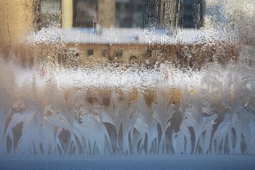 Frosty natural pattern on winter window