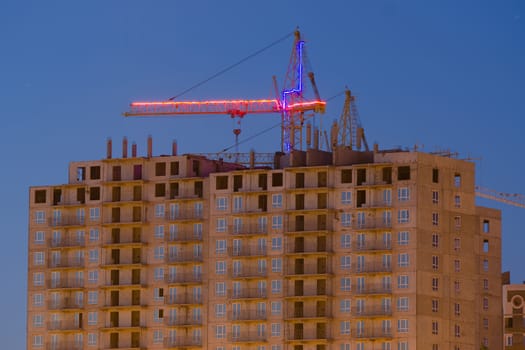Construction of multi-storey building with a crane
