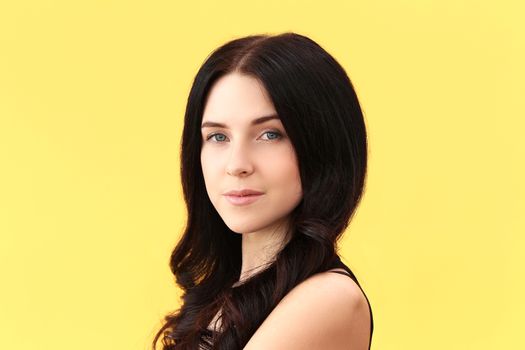 Beautiful girl on a yellow background