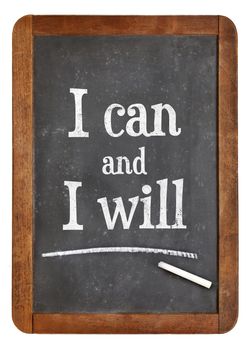 I can and I will - motivational text on a vintage slate blackboard