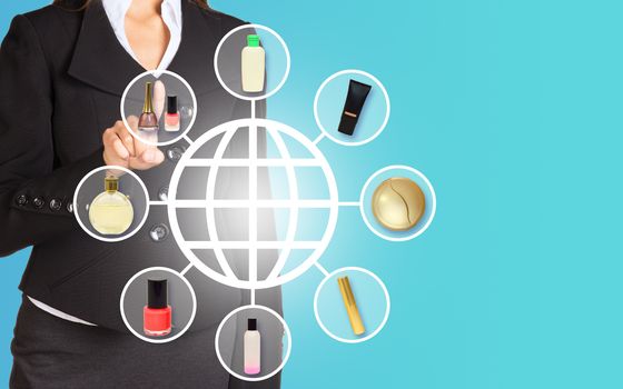 Businesswoman pressing on holographic screen with different cosmetics