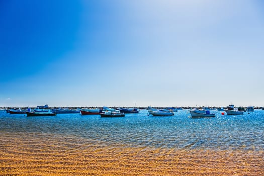 Boats on the water with waves in bay or harbor