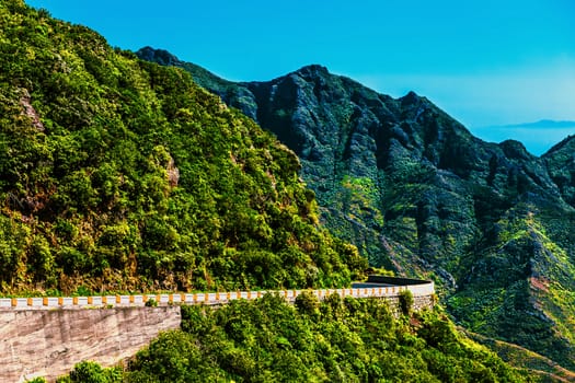 Green mountains or rocks with road and blue sky with cloud landscape in Tenerife Canary island, Spain at summer or spring