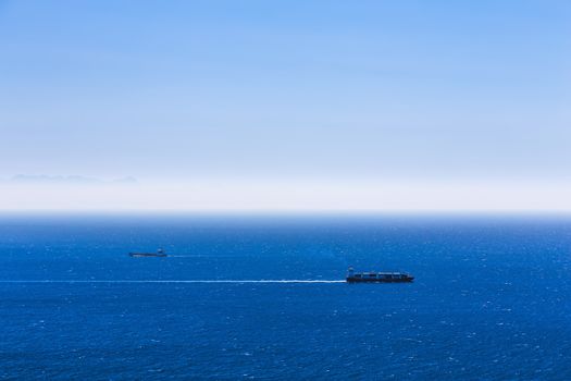 Cargo ships with containers in the open Atlantic ocean
