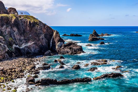 Coast or shore of Atlantic ocean with or rock and  sky with clouds and skyline in Tenerife Canary island, Spain at spring or summer