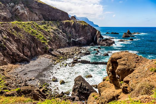Coast or shore of Atlantic ocean with  mountain or rock and blue sky with clouds and horizon in Tenerife Canary island, Spain at spring or summer