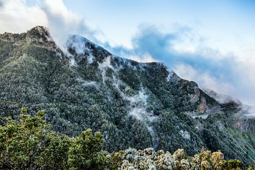 Mountain and clouds over peak with road in Tenerife Canary island, Spain