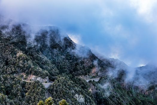 Landscape with clouds over mountain with winding road in Tenerife Canary island, Spain
