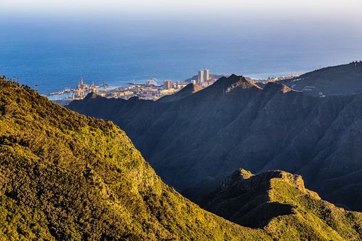 Coast of Atlantic ocean with green mountain or rock and  sky with skyline in Tenerife Canary island, Spain at spring or summer