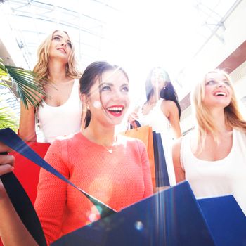 beautiful young women shopping at mall