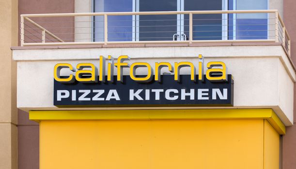 VALENCIA, CA/USA - MAY 17, 2015: California Pizza Kitchen exterior. California Pizza Kitchen is a casual dining restaurant chain that specializes in California-style pizza.