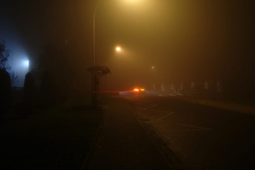 lights on a street at the foggy night