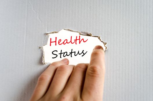 Hand and text on the cardboard background Health Status