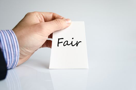 Business man hand writing Fair