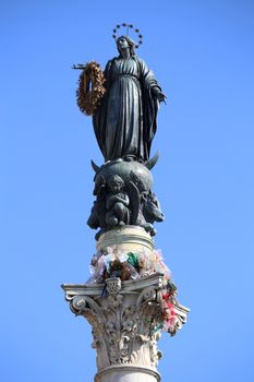 Column of the Immaculate Conception monument with Virgin Mary on top at Piazza di Spagna in Rome, Italy